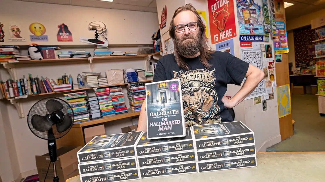 Matt Jehan from the Lexicon in St Peter Port is pictured with copies of the new J K Rowling book, The Hallmarked Man