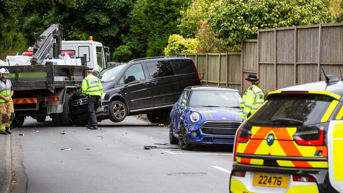 The damaged Mini can be seen at the stop line for the traffic lights junction, while the Mercedes van was pushed back by the impact with the lorry and lifted onto a low wall. (Picture supplied by Sydney Prosser)