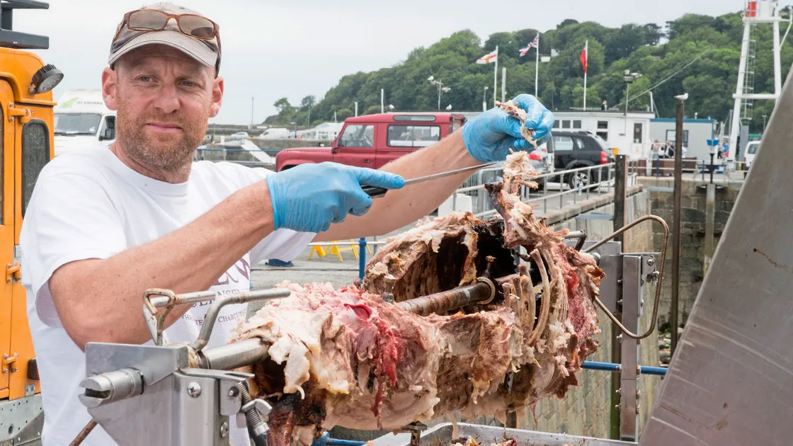 Mark Terry, from Willows, spit roasting a pig. (24823780)