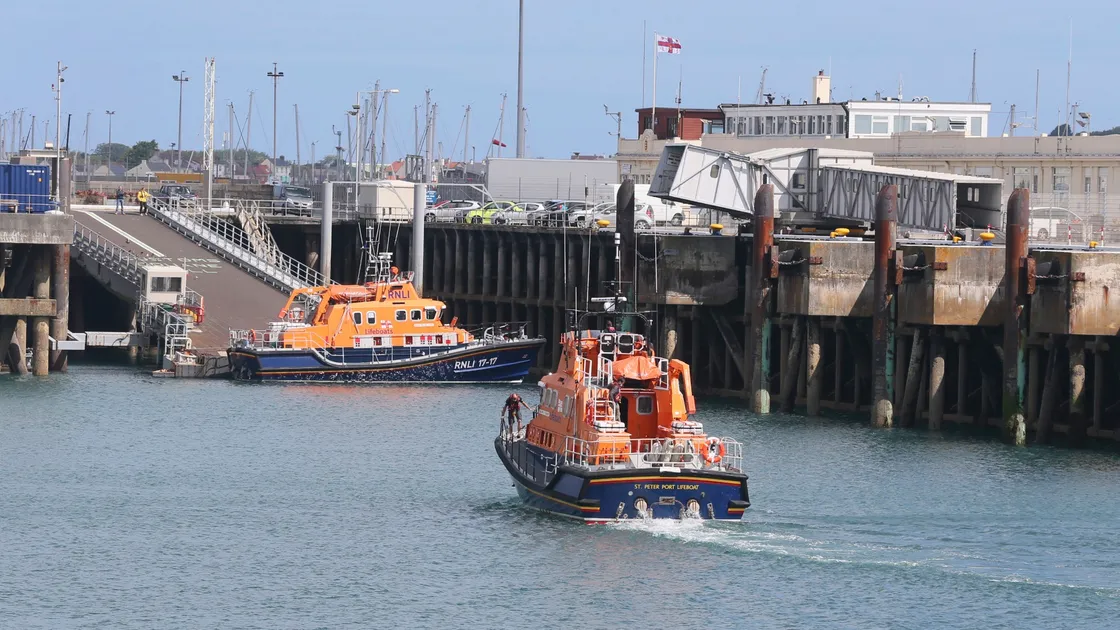 Pic by Adrian Miller 02-07-20 St Peter Port Harbour. Lifeboat RNLB Spirit of Guernsey returns from the Isle of White after being repaired. The relief lifeboat Fraser Flyer is in the background.. (28426547)