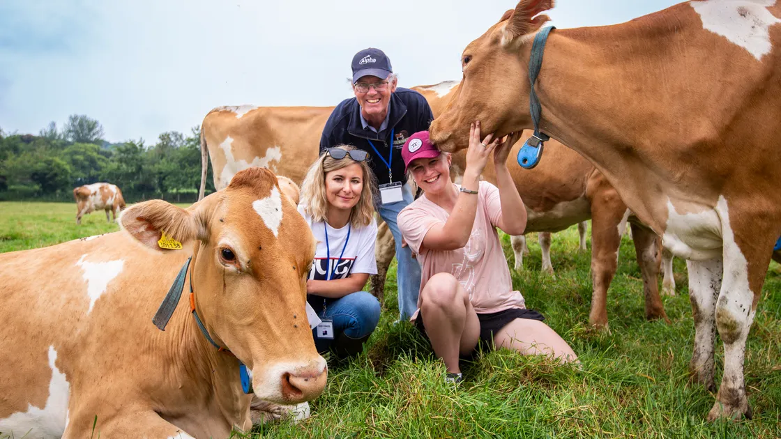 New Zealand farmer Tim Edwards was delighted to visit the home of the Guernsey cow. He is seen with his nieces Sarah, left, and Rebekah. (Pictures by Luke Le Prevost, 32221657)