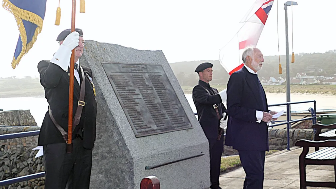 Submariners and families attending the memorial service at Braye Beach in Alderney to mark the 75th anniversary of the loss of HMS Affray.