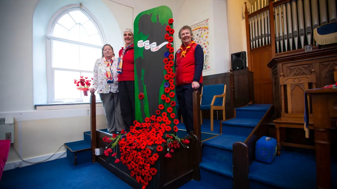 Local Trefoil Guilds have made a knitted poppy display for the United Reformed Church in St Saviour’s. Left to right, Sandra Sarre of the Guernsey Guild and Kay Harvey and Sue Veillard of the Sarnia Guild. (Picture by Peter Frankland, 30180833)