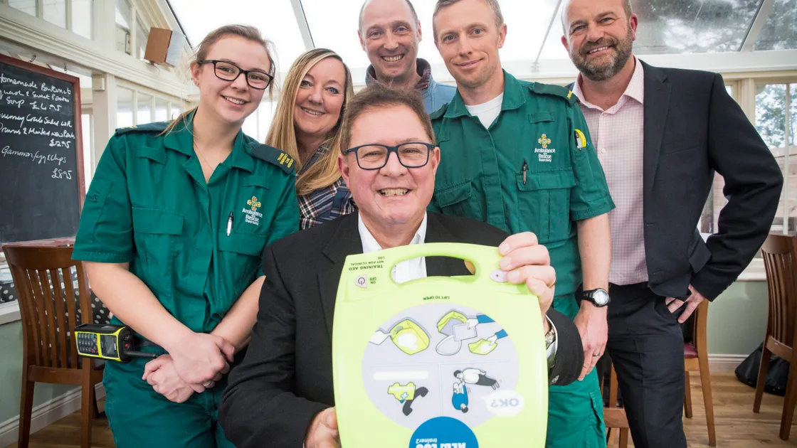 Rick Denton with a defibrillator. Standing behind him are, left to right, Charlotte Smith, emergency care assistant at St John, Lynette Symons, Paul Hancock, paramedic Dom Fletcher from St John and St John training manager Steve Ford. (Picture by Adrian Miller, 24085235)
