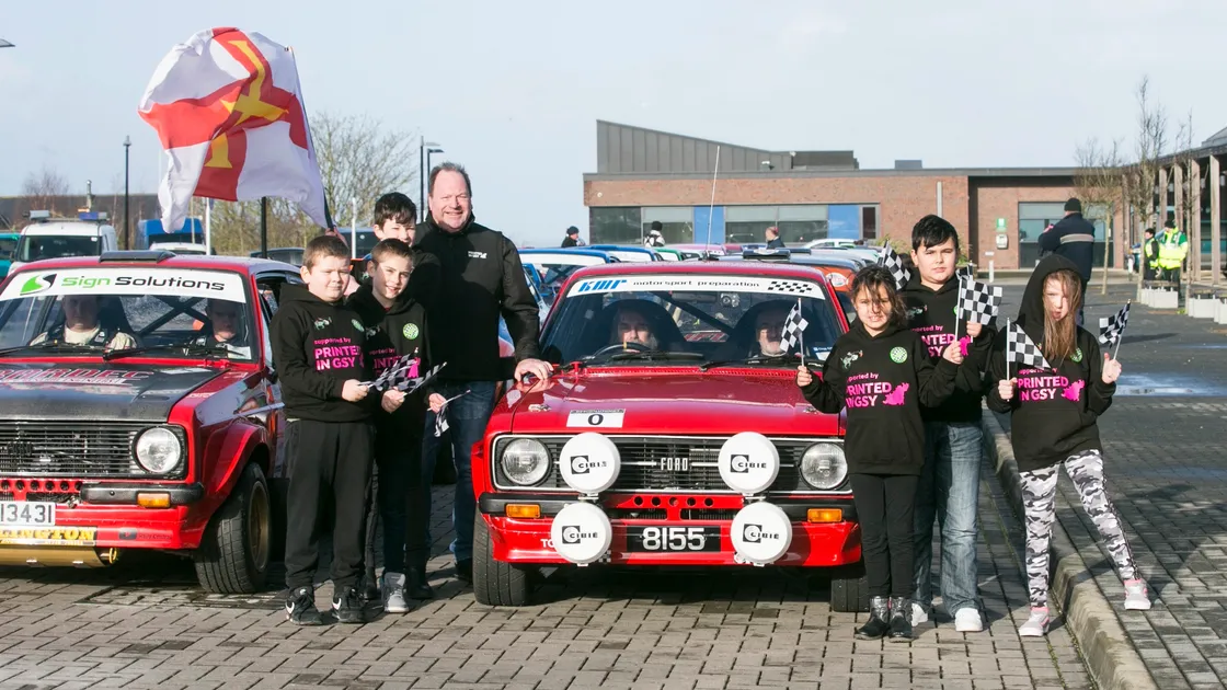 The drivers in the 3rd Resolution IT Guernsey Rally were sent on their way from Les Beaucamps High School on Saturday by six children from Le Rondin School who had won the honour in a colouring competition. Left to right, Charlie Campbell, 9, Braiden Dennis, 10, Rory Hodder, 11, Ameliah Anslow, 8, Kian Prigent, 10, and Jody Spence, 10. With them is John Dodsworth, of Printed, who sponsored their rally hoodies. (Picture by Adrian Miller, 27320849)
