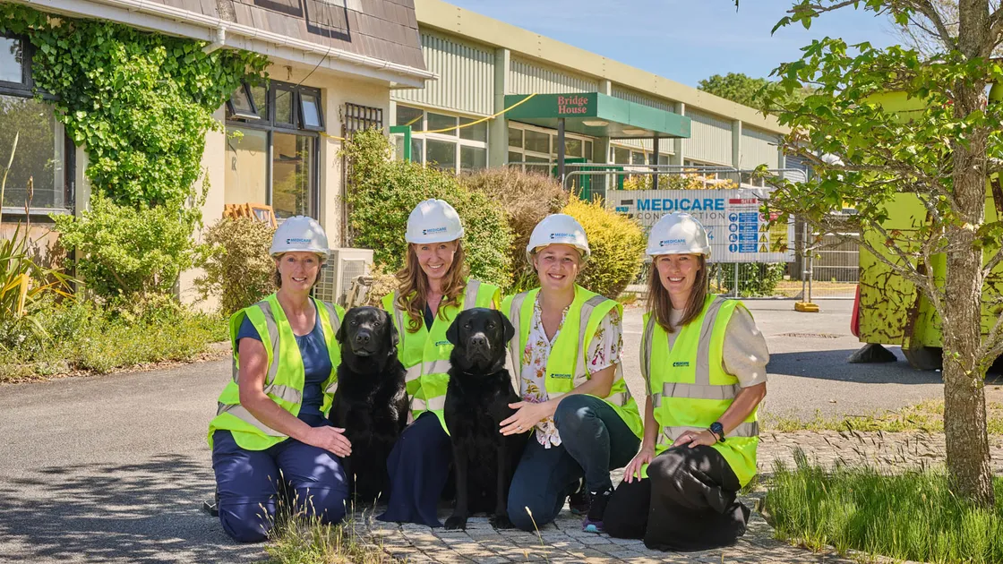 Isabelle Vets clinical directors, left to right: Sarah-Jane Heathcote, Doreen Munn-Litten, Kiara Mills and Mairi Le Cocq, with dogs Winston and Stanley, on the site of the vets’ new premises at Garenne Park.
