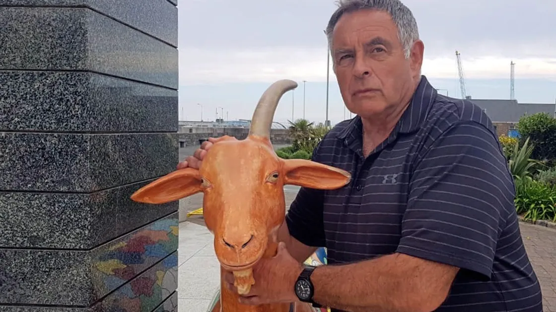 Peter Sirett with the damaged Autism Guernsey goat at the Liberation Monument. (Picture by Cassidy Jones, 29630051)