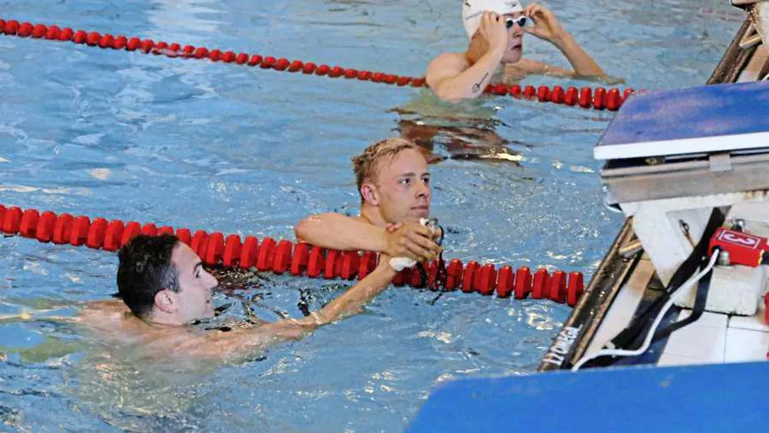 Swim team coach is given golden birthday