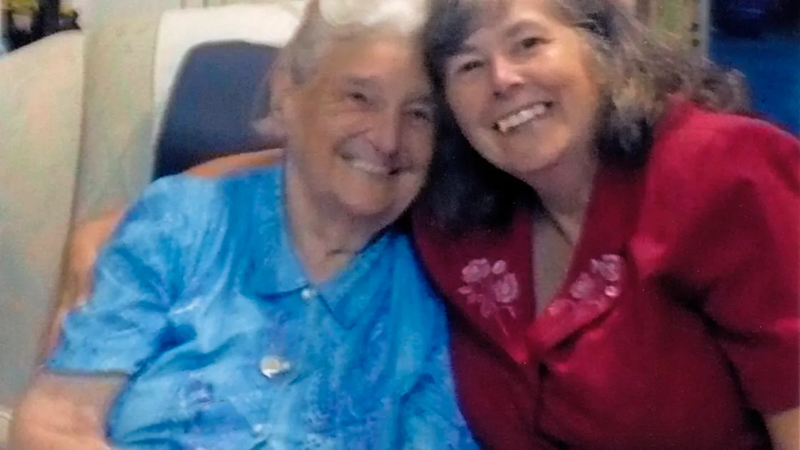 New Year Honours award winners – on the left is British Empire Medal award winner Anne Diamond (in red), with the late Ruth Torode, and on the right is GTTA president Derek Webb, who is to receive the MBE (Member of the Order of the British Empire).