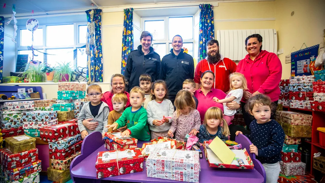 Picture by Peter Frankland. 02-11-20 Children at Little Learners Nursery have been helping to pack shoeboxes to be sent to third world countries..They have been helped by members of law enforcement, Just Games and other small businesses. With L-R- Kellie Eboral, Little Learners, Rebecca Falla and Adam Le Huray of Guernsey Border Agency, Samantha Mahy, Little Learners, Stuart Leon, Just Games and Heidi Garnham of Little Learners.. (28867664)