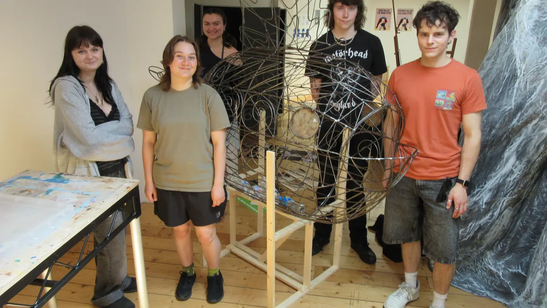 The students with their fish sculpture from the Suntera Global initiative.	