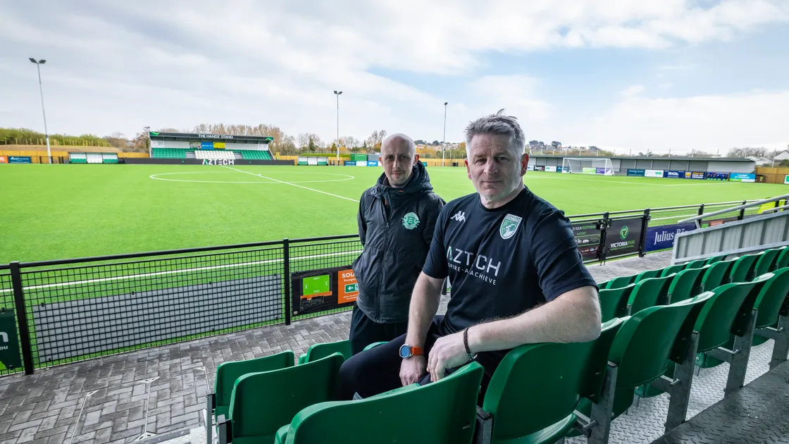 Guernsey FC manager Tony Vance and, behind him, Guernsey FA CEO Gary Roberts at the new home of island football.