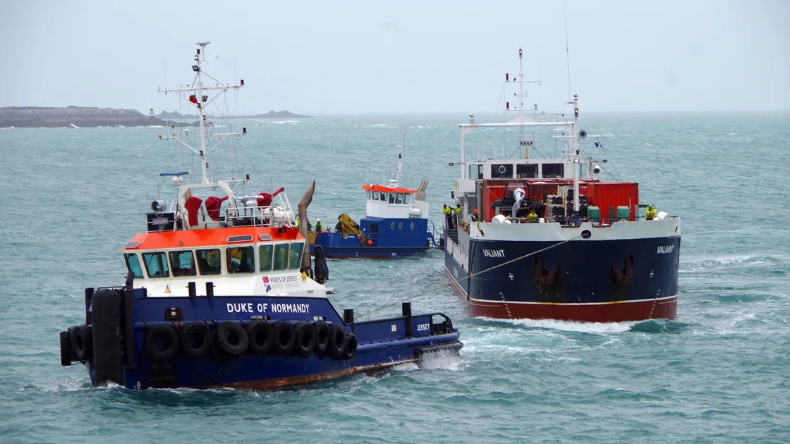 Jersey Port Authority tug Duke of Normandy towing MV Valiant towards St Peter Port Harbour with Guernsey Harbourss workboat Sarnia standing by at the stern for instructions from St Peter Port pilot Les Dorey. (Pictures by Tony Rive)