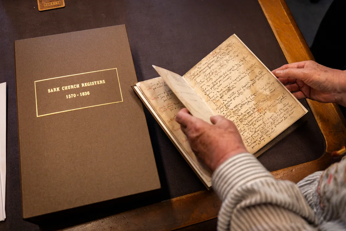 The first book is dated 1570 to 1603, and the first names inside are from the baptism of twins Jacob and Sarah, whose descendants still live and work in Sark today as its greffier and postie.