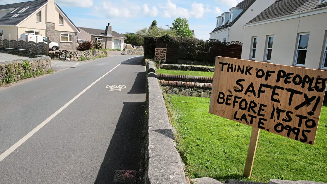 Residents of Oatlands Lane have put up signs up at the front of their properties in protest of proposals to change the use of the adjacent vineries.                                                        (Picture by Adrian Miller, 21302952)