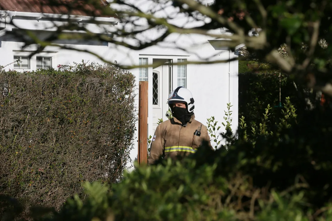 A firefighter outside the property. (Picture by Adrian Miller, 29286901)
