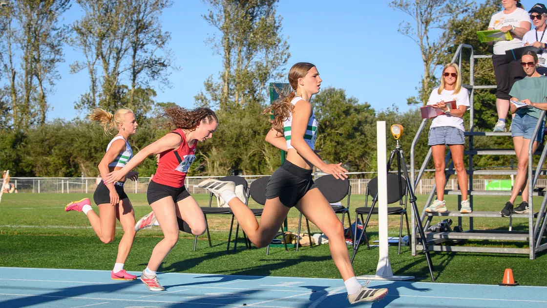 Joselyn Ford crosses the line ahead of Wimborne’s Nicola Minina and Indi Warren, who both clocked personal bests for the 100m.
