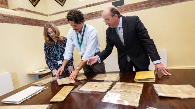 Academics on visit to study medieval manuscript pieces