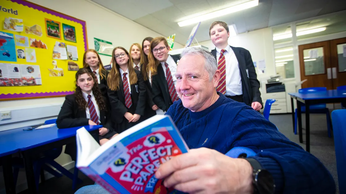 Children’s author Stewart Foster, who writes about mental health, visited La Mare De Carteret High School during the Guille-Alles Library’s Book Week. He is seen with Year 8 students, left to right, Kelynn Goubert, Demi Le Moigne, Molly Lowe, Tanika Roussel, Marla Naftel, Wills Coleman and Reuben Grimes. (Picture by Peter Frankland, 31959843)