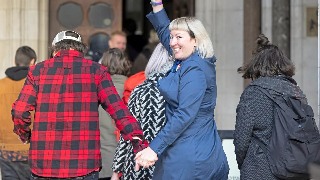 Emma Smart waves to supporters as she goes into court where she was sentenced to four months in prison for her part in the Insulate Britain protests. (Picture by PA News)