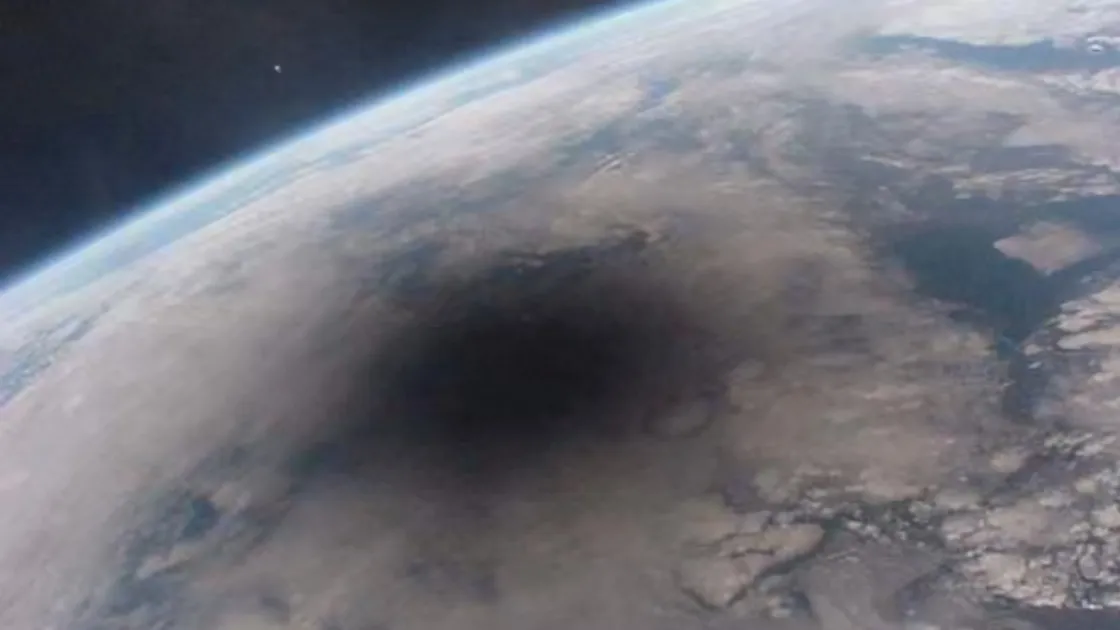 The 1999 solar eclipse from the Russian Mir space station showing the Moon’s shadow on Earth. 