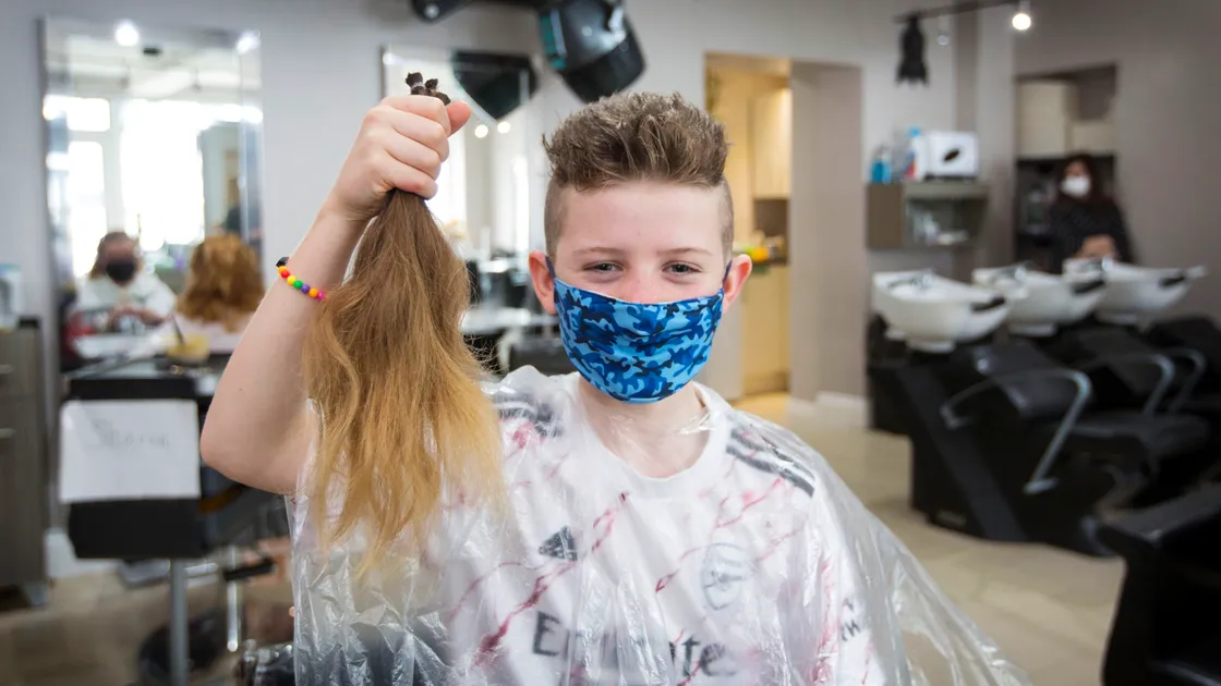  Jacob Morgan, 10, holds his foot-long hair which was cut off on Saturday after it took him three years to grow. The Little Princess Trust is a double beneficiary. (Pictures by Adrian Miller, 29331638)