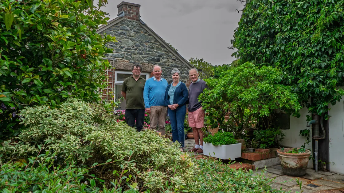 Left to right: St Peter’s Church and Forest Church rector Adrian Datta, Sir Richard Collas and Sally and Stuart Hardie in the Hardies’ St Peter’s garden.			