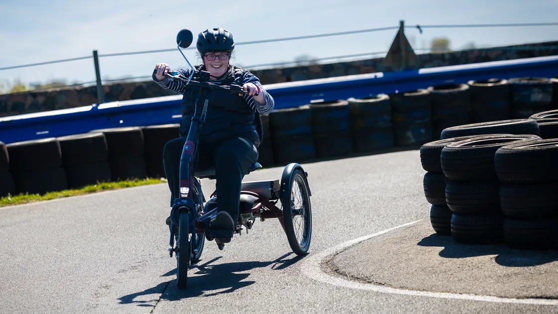 Kels Le Prevost at yesterday's summer relaunch of Wheels for You at The Track where people with disabilities were able to try out adapted bikes.