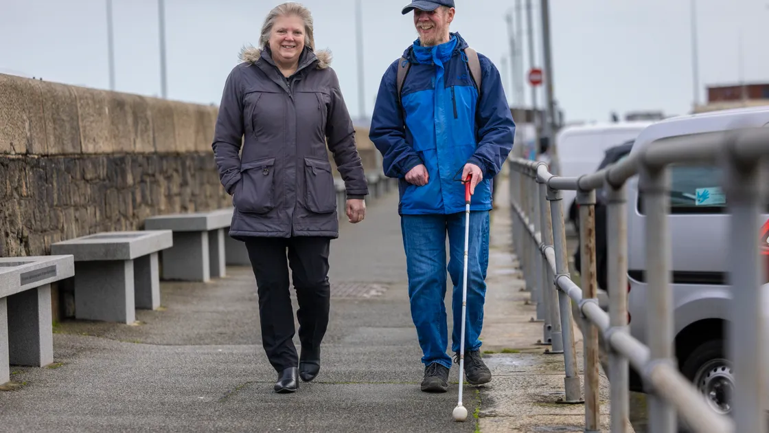 Corinne Connolly organised a fundraiser to raise money for Guide Dogs Guernsey. She is pictured with Simon De La Mare, who lost his guide dog, Cyril in December