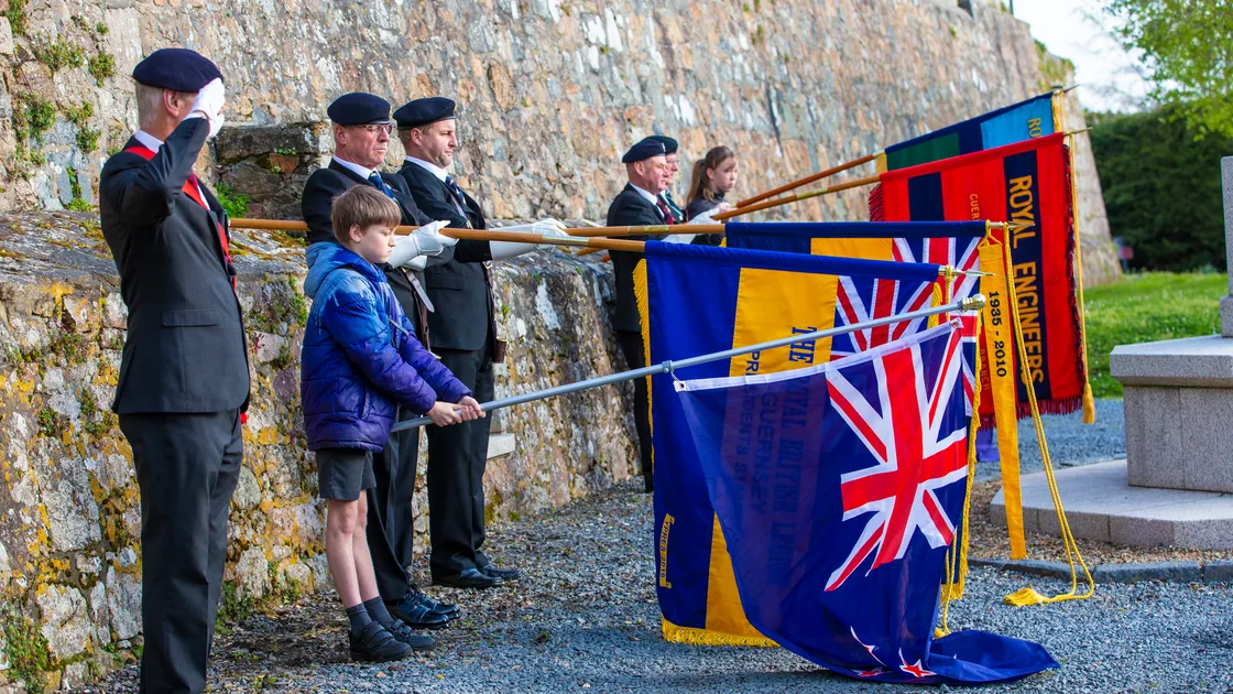 The standards of the Royal British Legion are dipped to honour the Australian and New Zealand servicemen who died at Gallipoli. The honour of carrying the New Zealand flag was given to 10-year-old Nathan Sanders, left, while Poppy Robison, 12, far right, was flag bearer for Australia.  (Pictures by Peter Frankland, 32043453)