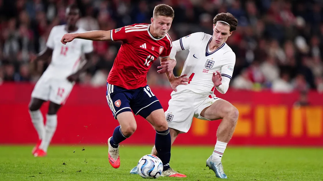 Alex Scott (right) challenging Czechia's Lukas Cerv on his full international debut in Prague.