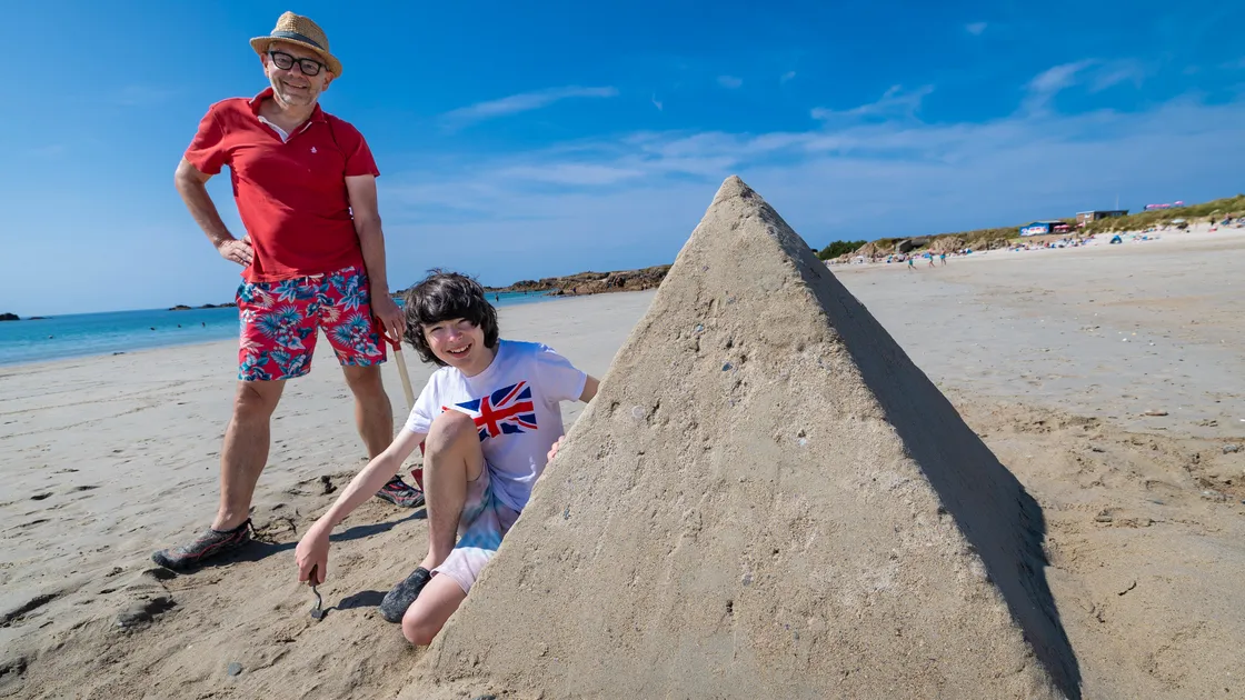 Visitors Donnie Higham, 14, and dad Dan have been causing a stir on local beaches with their impressive sand sculptures. 					 (Picture by Peter Frankland, 34849980)
