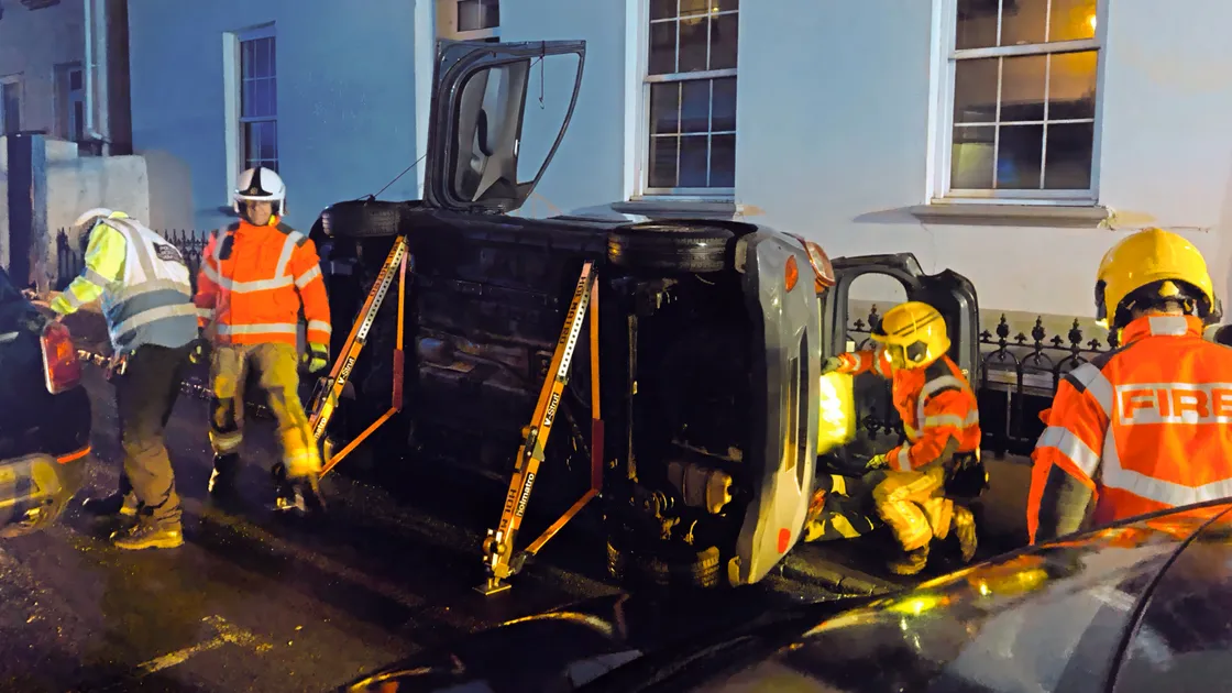 A hatchback car flipped onto its side in Victoria Road on Tuesday night after hitting another vehicle parked at the side of the road. (Picture by Andy Brown, 33991935)