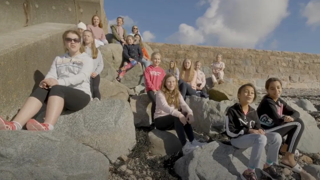 A still from the Our Only World video featuring by Ladies’ College students. Much of it was shot locally with the opening sequences recorded at Vazon.