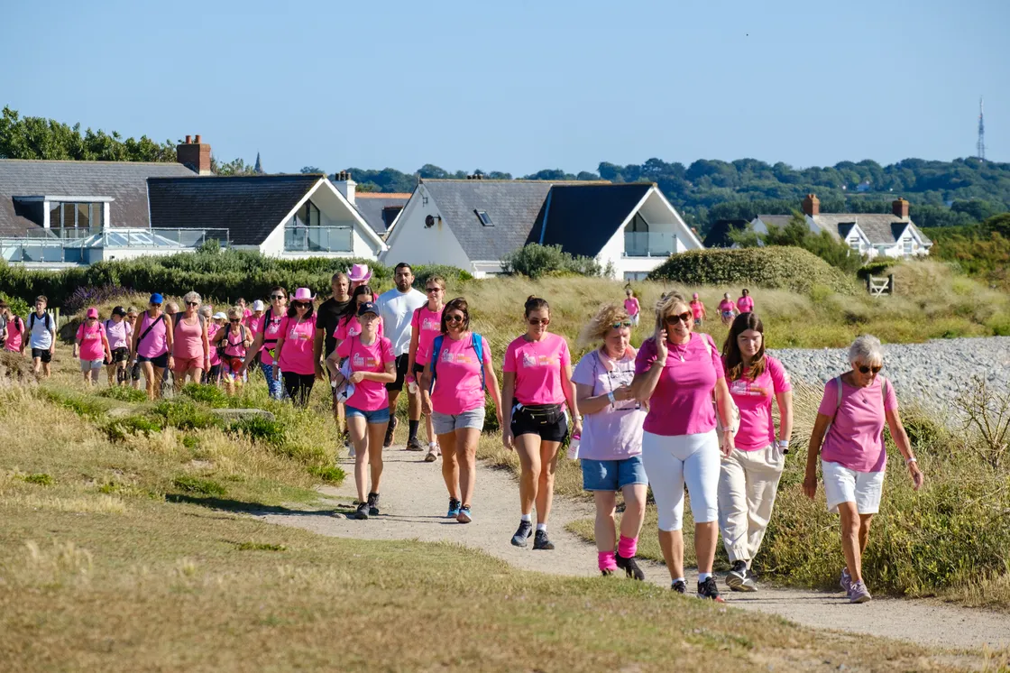 More than 1,500 people donned loud pink attire as they began their walk from either Grandes Rocques or Bordeaux and finished in Market Square in town on Saturday evening.