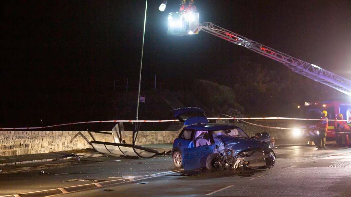 Engineers from Guernsey Electricity check the street lamp which was hit in the crash in which Katie Le Huray, 21, lost control of her Mini after drinking heavily in Town and destroyed a bus shelter. (29842046)