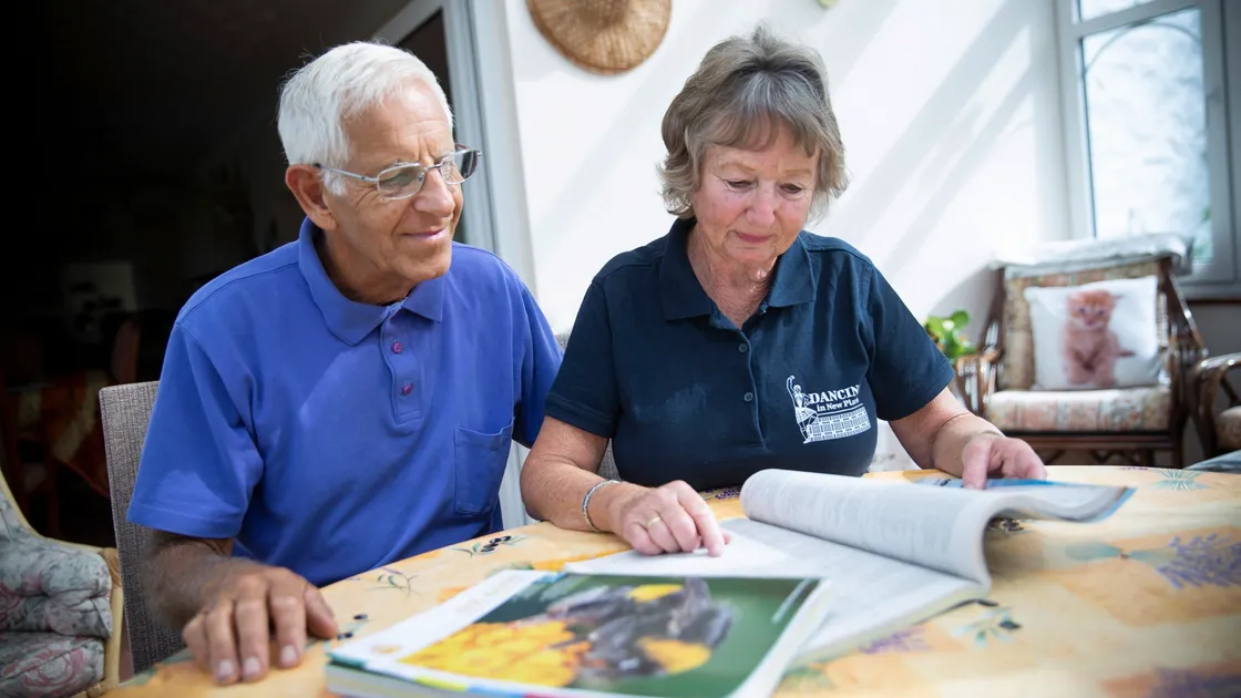 Ivan and Christine Babbe have a look through the new Sure 2019/2020 phone book.  (Picture by Peter Frankland, 25876077)