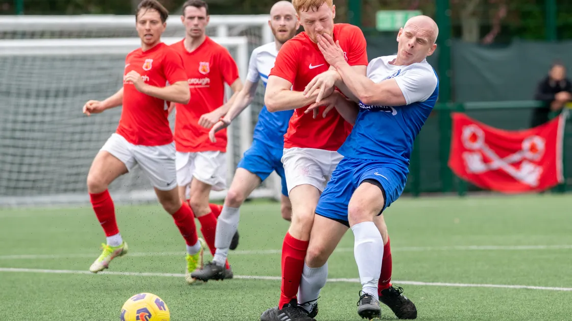 St Peter's Tom Blampied had Martin Savident under control for most of the game at Springfield. (Picture by Jon Guegan, Jersey Evening Post)