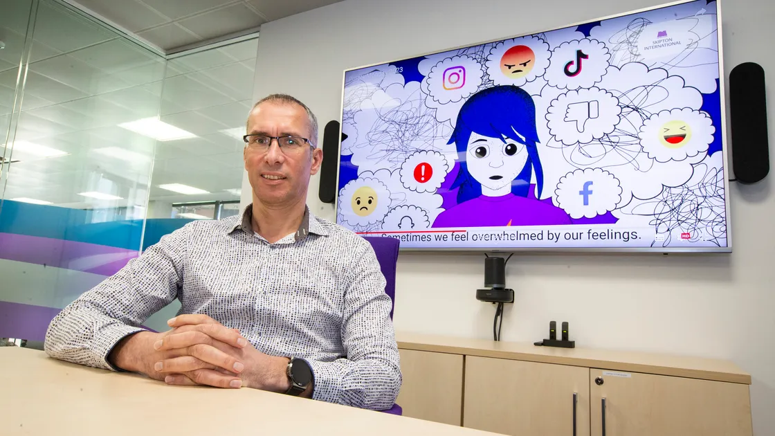 Skipton International managing director Jim Coupe and behind him one of the animations from the video it has had produced by Orchard PR to help young people on what has become known as Blue Monday, supposedly the most depressing date of the year. (Picture by Luke Le Prevost, 31677767)