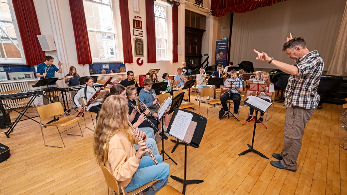 Teacher David Ansell with the Intermediate Wind Band practising at Elizabeth College ahead of their concert at St James this weekend