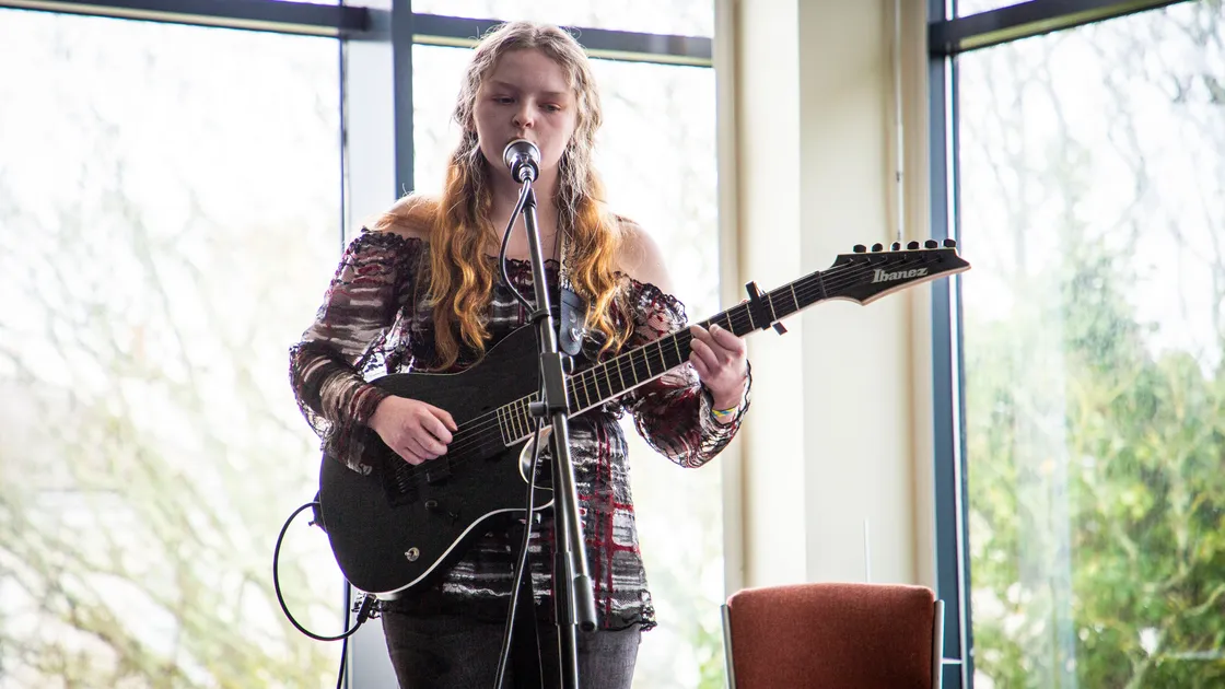 Kiya Ashton performing in the Acoustic Cafe at February’s Sound at St James. She and fellow musician Jay Taylor are the driving forces behind a group of local musicians who are putting on live streams to entertain islanders. (Picture by Sophie Rabey, 27664312)