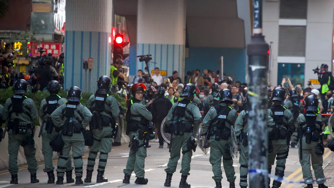 
              
Riot police stand guard as lawyer and newly elected district councillor arrive at the Polytechnic University to meet the left-over protesters in Hong Kong, Monday, Nov. 25, 2019. Hong Kong's pro-democracy opposition won a stunning landslide victory in weekend local elections in a clear rebuke to city leader Carrie Lam over her handling of violent protests that have divided the semi-autonomous Chinese territory. (AP Photo/Ng Han Guan)
            
 (26463754)