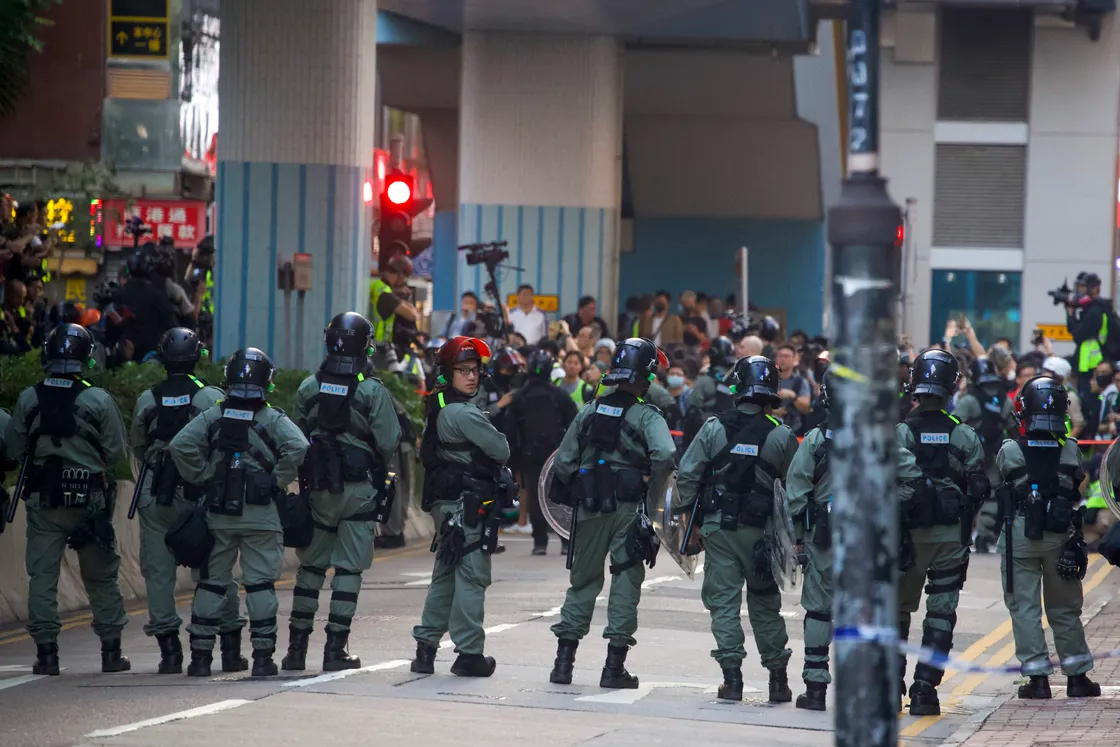
              
Riot police stand guard as lawyer and newly elected district councillor arrive at the Polytechnic University to meet the left-over protesters in Hong Kong, Monday, Nov. 25, 2019. Hong Kong's pro-democracy opposition won a stunning landslide victory in weekend local elections in a clear rebuke to city leader Carrie Lam over her handling of violent protests that have divided the semi-autonomous Chinese territory. (AP Photo/Ng Han Guan)
            
 (26463754)