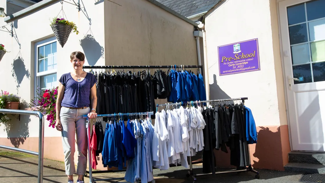 Alison Hamer at Torteval Pre-school with the second-hand uniforms she has put on sale for the fraction of the price of a new one. (Picture by Cassidy Jones, 29767537)