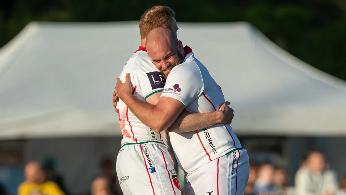 Together in harmony: pan-island cooperation on the rugby pitch last summer between Guernsey’s Anthony Armstrong (left) and Jersey’s Tom Wilson when the Channel Islands Select XV played Sweden