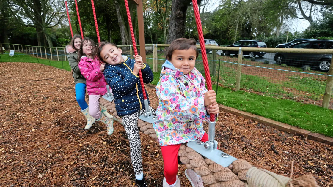 Children enjoying the rope swing at Saumarez Park’s new playground on Saturday. Left to right, Ella Tersigni 11, Amy Tersigni, 7, Serena Reddy, 5, and Elissa Reddy, 3. Right, fun on the ‘twirly- whirly’. (Picture by Adrian Miller 19823561/6)