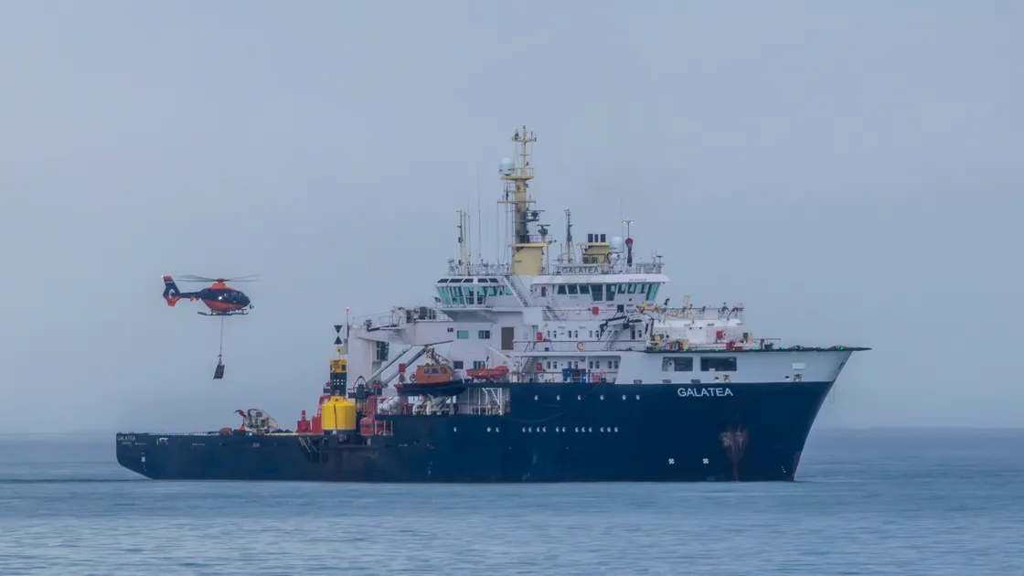A helicopter collecting material from the Trinity House ship THV Galatea for Hanois lighthouse. The vessel is designed with the capabilities for buoy handling, wreck marking, towing and multibeam and side scan hydrographic surveying 