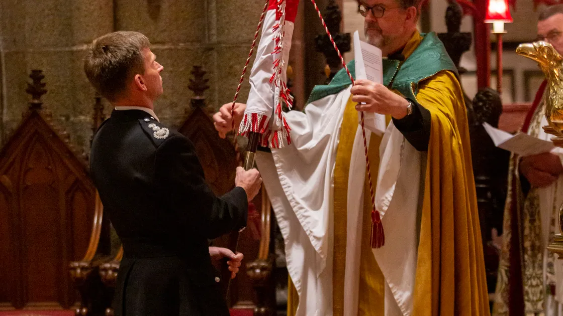 Chief fire officer Jon Le Page and receives the Fire & Rescue Service’s new standard from the Dean of Guernsey, the Very Rev. Tim Barker.  (31378031)