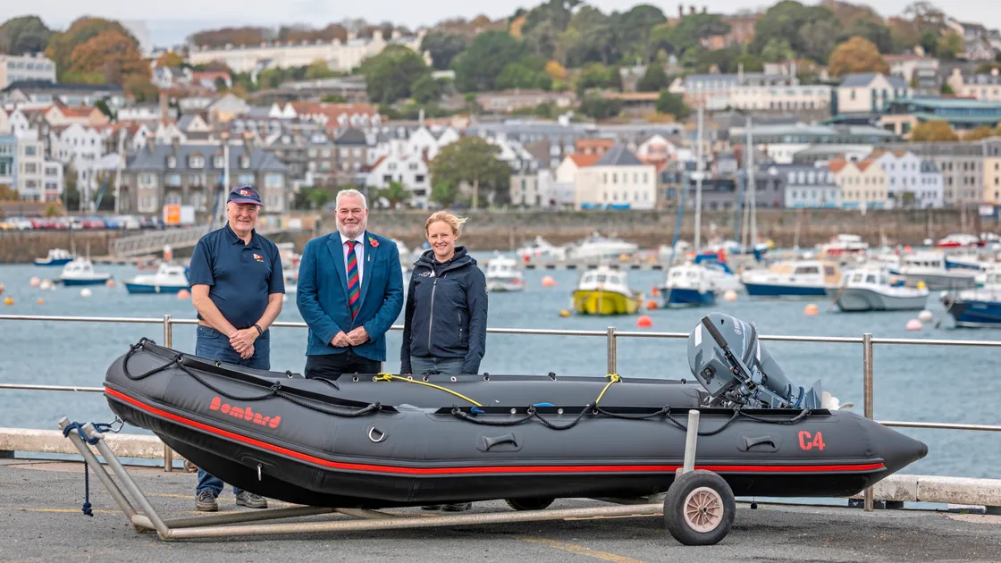 Left to right, GYC’s rear commodore for juniors Mike Chapple, Lord’s Taverners Guernsey chairman Alan Trustum, and Guernsey Sailing Trust principal Sarah Creasey with the new safety boat for local dinghy sailing