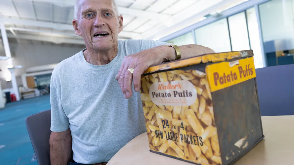 Frank Marquis with his Walter’s Potato Puffs tin which he found in his loft. It dates back to the 1930s.